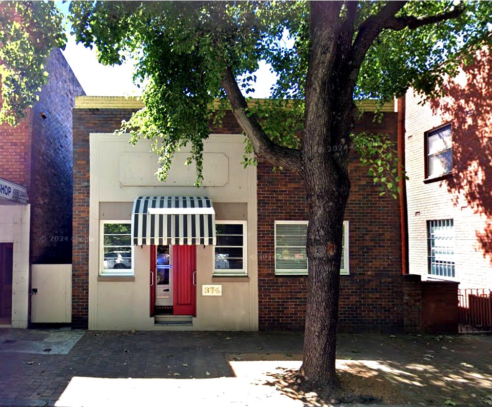 Full Argyle Street frontage of 374 Argyle Street beneath the large street tree