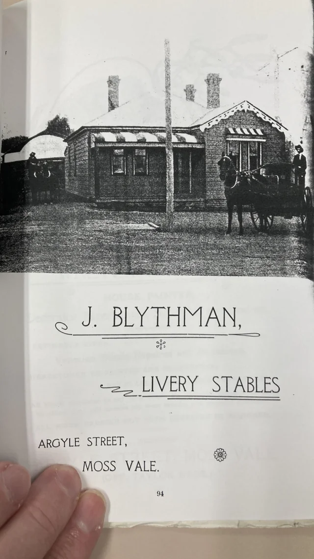 Page 94 showing the cottage photograph above J. Blythman’s advertisement for livery stables in Argyle Street, Moss Vale.