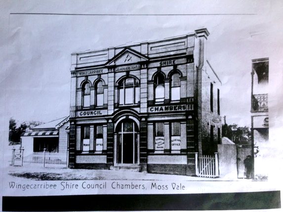 The former Masonic Hall and council chambers with the weatherboard building at 374 Argyle Street on the left
